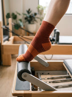 FA Socks Lifestyle - Orange Grip Socks on Footbar